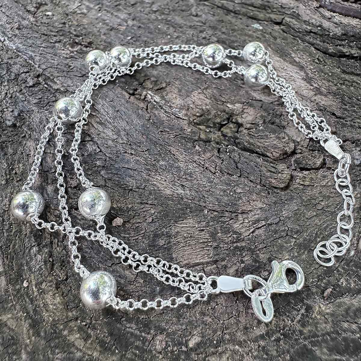Pulsera de Tres Hilos y Bolas de Plata de Ley