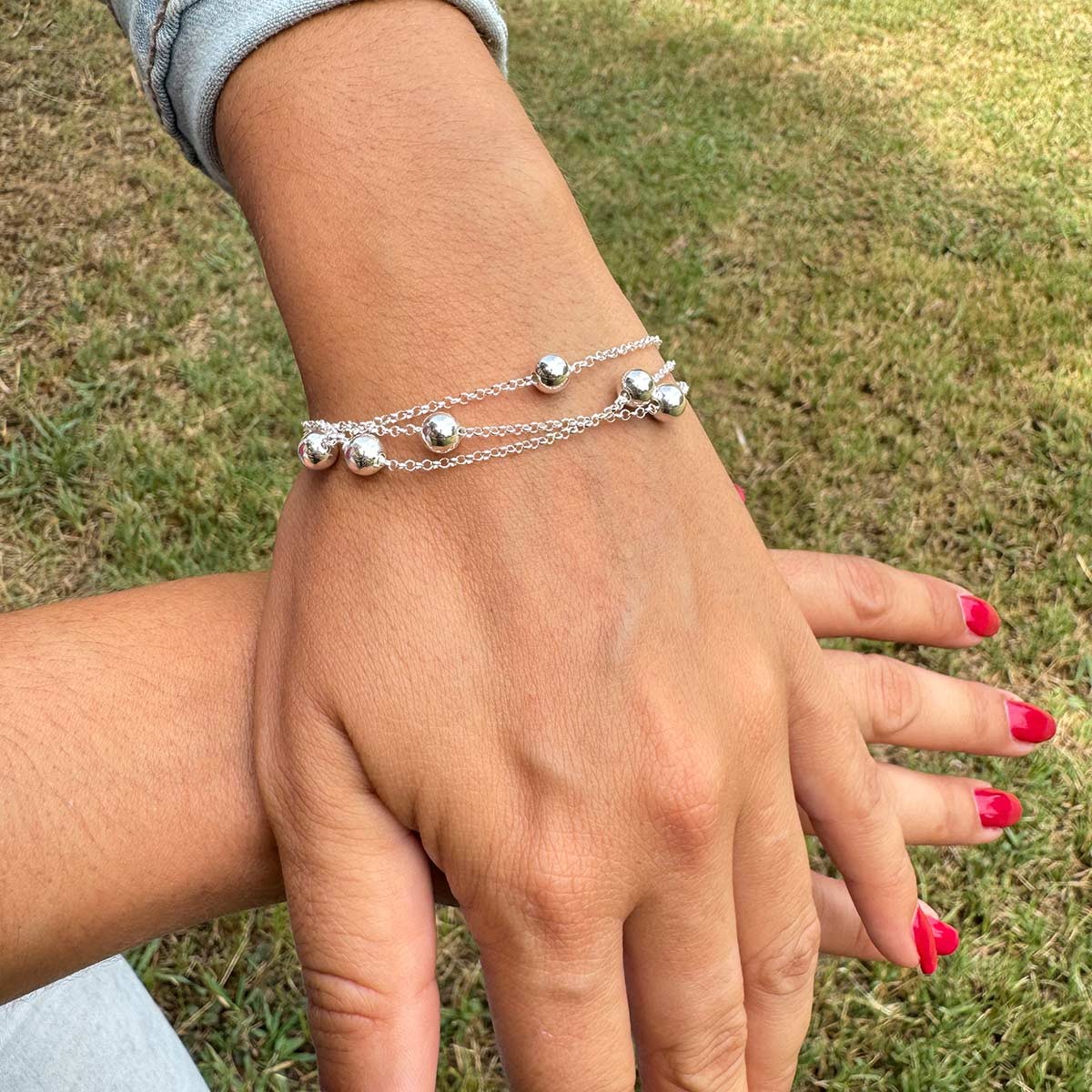 Pulsera de Tres Hilos y Bolas de Plata de Ley